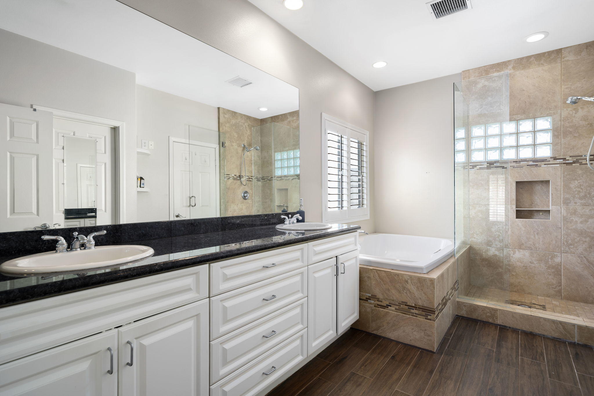 2120 West Nicola Road Palm Springs, CA 92262 - Photo 31 of 37 a spacious bathroom with a granite countertop double vanity sink a mirror and a bathtub