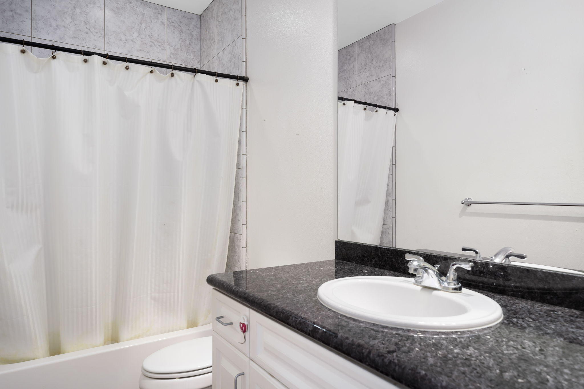 2120 West Nicola Road Palm Springs, CA 92262 - Photo 35 of 37 a bathroom with a granite countertop sink and a mirror