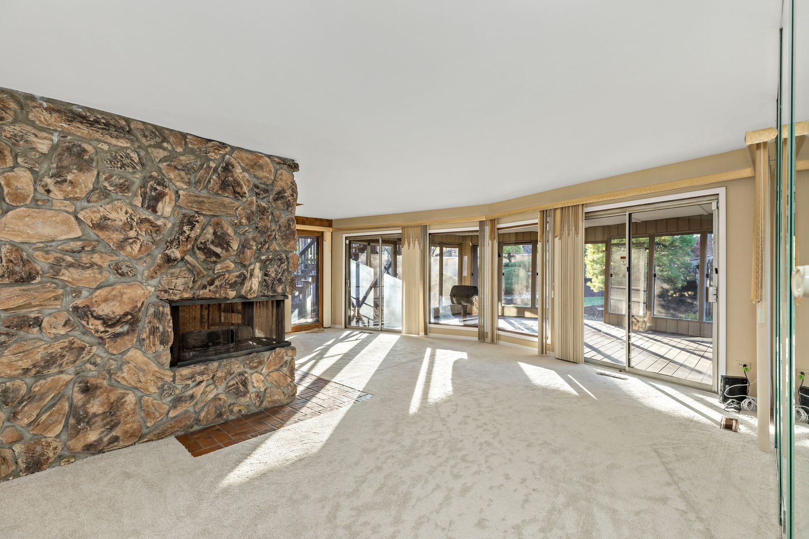 18740 Springfield Avenue Flossmoor, IL 60422 - Photo 6 of 16 a living room with a fireplace and floor to ceiling windows