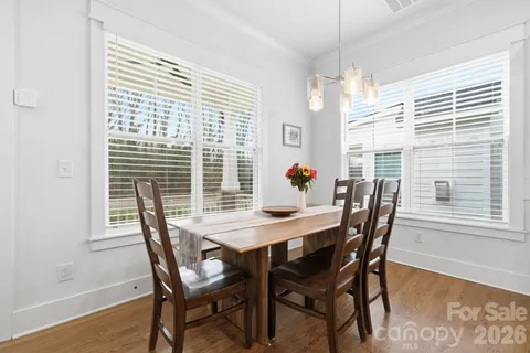 a view of a dining room with furniture and window