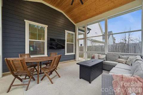 a outdoor living space with furniture and a potted plant