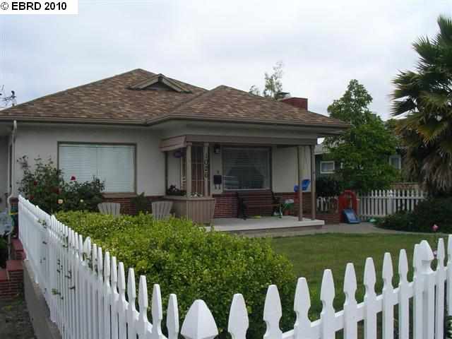 1026 Fourth Street Rodeo, CA 94572 - Photo 1 of 1 a front view of house with outdoor seating and yard