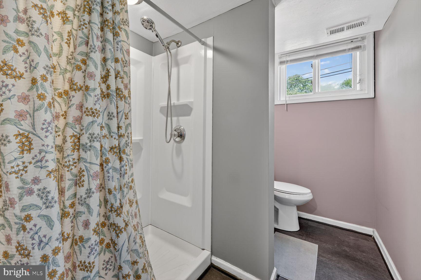 1104 Caddington Avenue Silver Spring, MD 20901 - Photo 21 of 35 a bathroom with a toilet and a shower