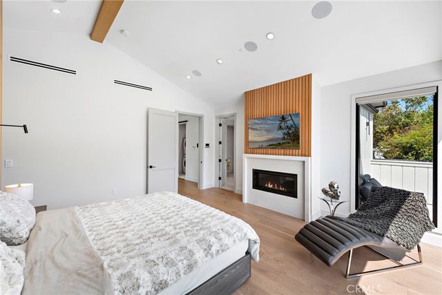 a bedroom with a bed and a fireplace