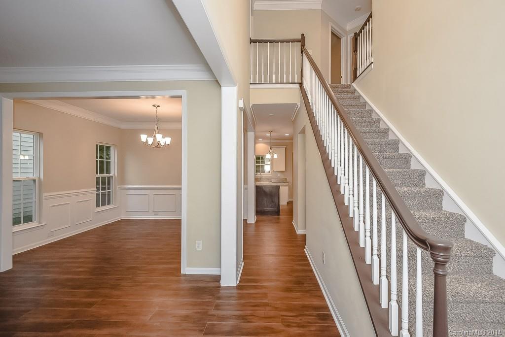 709 Warwick Way Fort Mill, SC 29708 - Photo 2 of 24 a view of an entryway with wooden floor and stairs