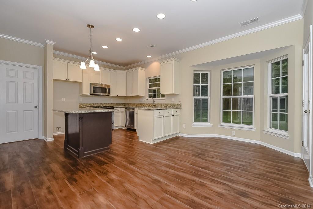 709 Warwick Way Fort Mill, SC 29708 - Photo 11 of 24 a view of kitchen with cabinets and wooden floor