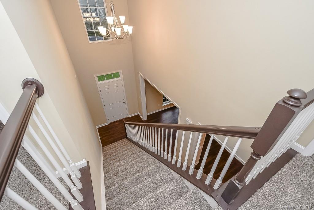 709 Warwick Way Fort Mill, SC 29708 - Photo 16 of 24 a view of staircase with railing and white walls