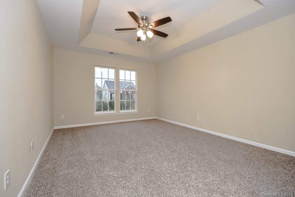 709 Warwick Way Fort Mill, SC 29708 - Photo 17 of 24 an empty room with a window and a fan