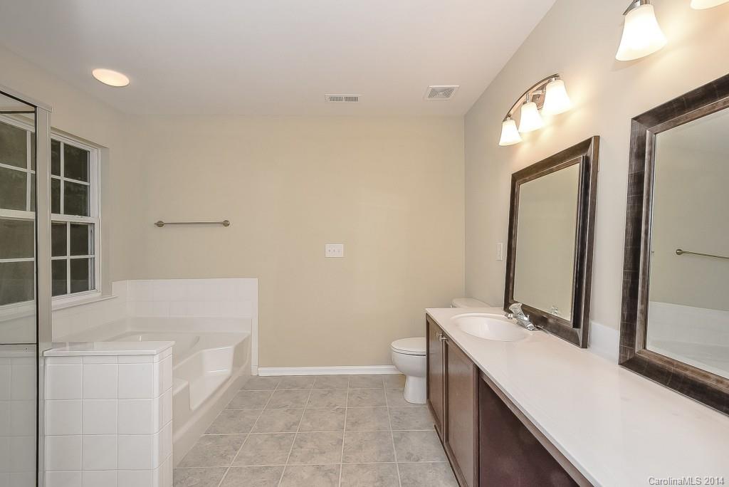 709 Warwick Way Fort Mill, SC 29708 - Photo 18 of 24 a bathroom with a double vanity sink and a mirror