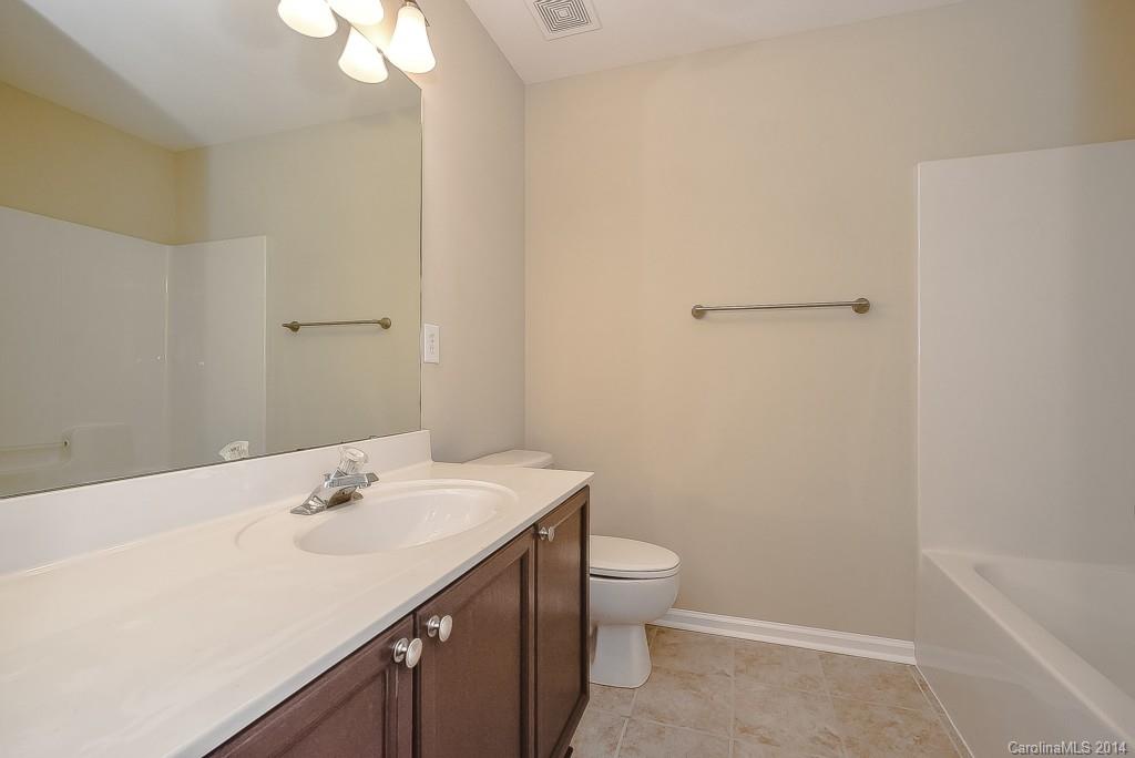 709 Warwick Way Fort Mill, SC 29708 - Photo 22 of 24 a bathroom with a sink a toilet and shower