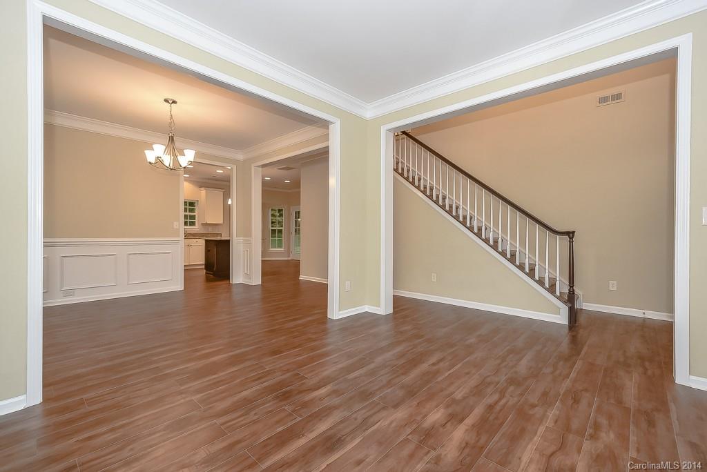 709 Warwick Way Fort Mill, SC 29708 - Photo 4 of 24 a view of a hallway with wooden floor