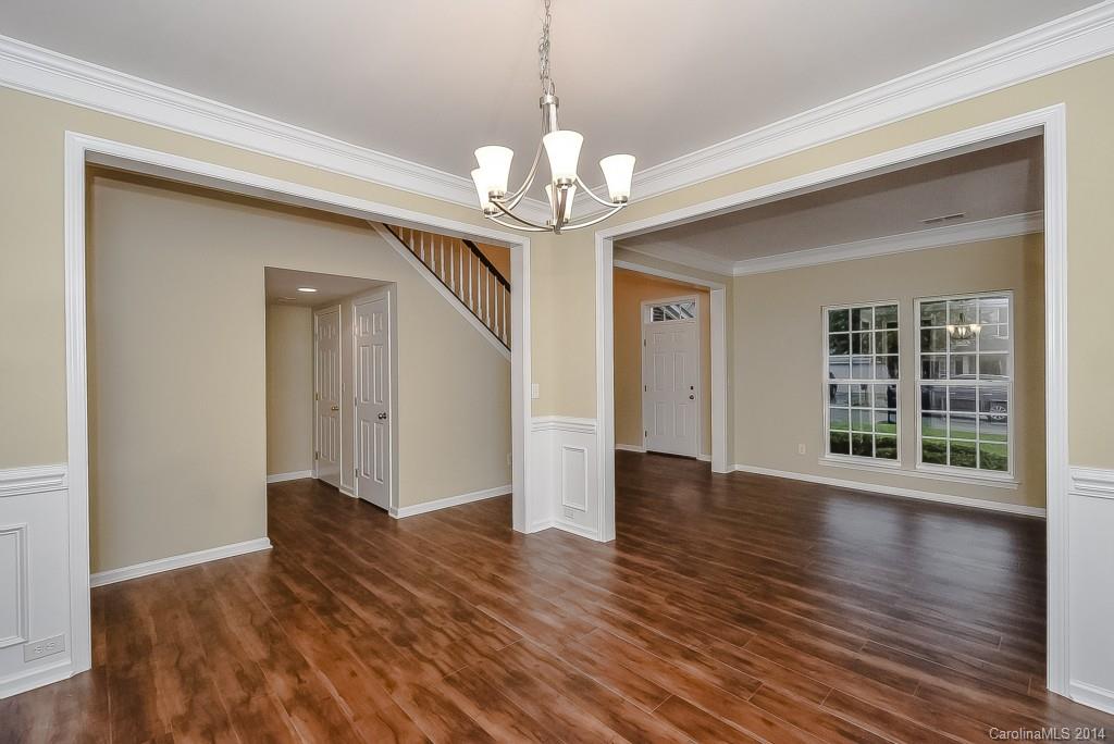 709 Warwick Way Fort Mill, SC 29708 - Photo 5 of 24 a view of an empty room with wooden floor and a window