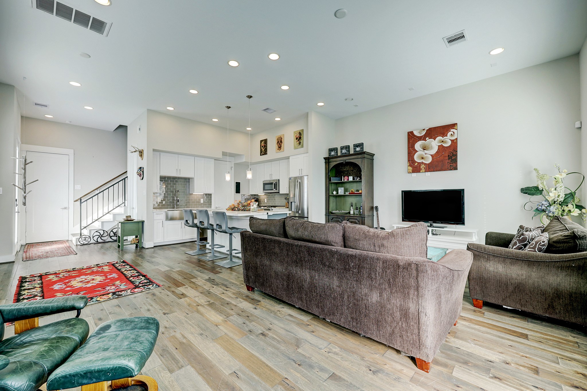 806 Thornton Road, Unit A Houston, TX 77018 - Photo 4 of 15 a living room with furniture and a flat screen tv