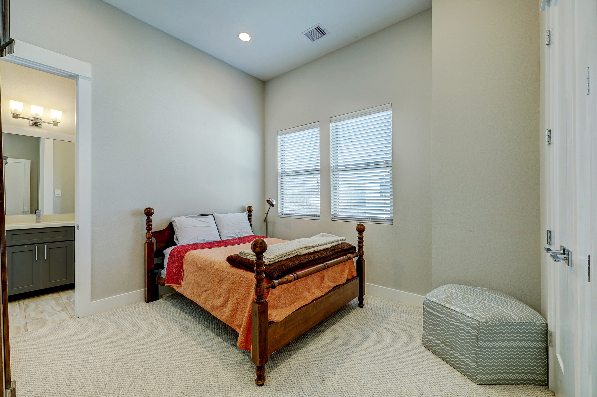 806 Thornton Road, Unit A Houston, TX 77018 - Photo 7 of 15 a bed sitting in a bedroom next to a window