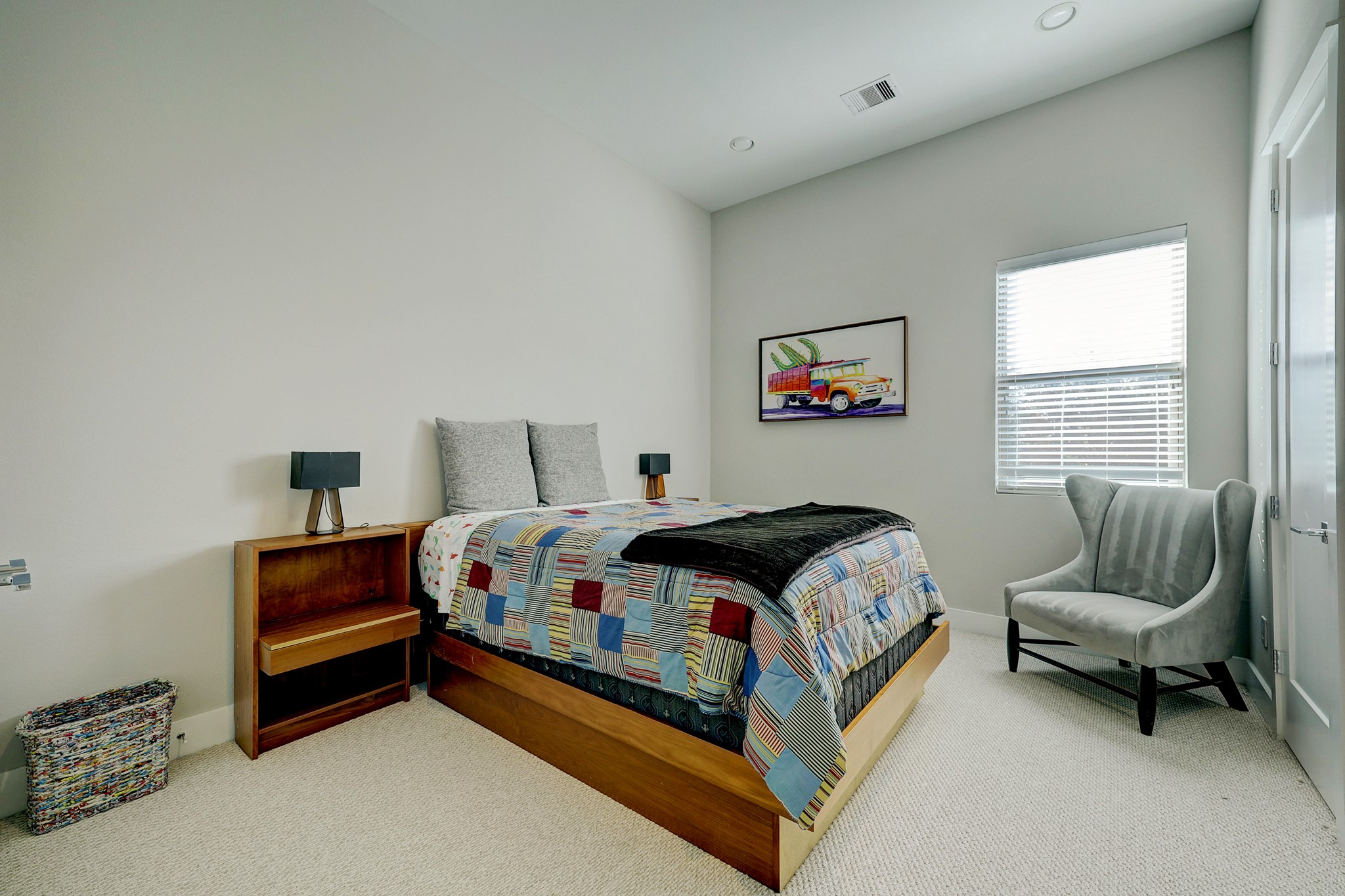 806 Thornton Road, Unit A Houston, TX 77018 - Photo 9 of 15 a bedroom with a bed and a couch