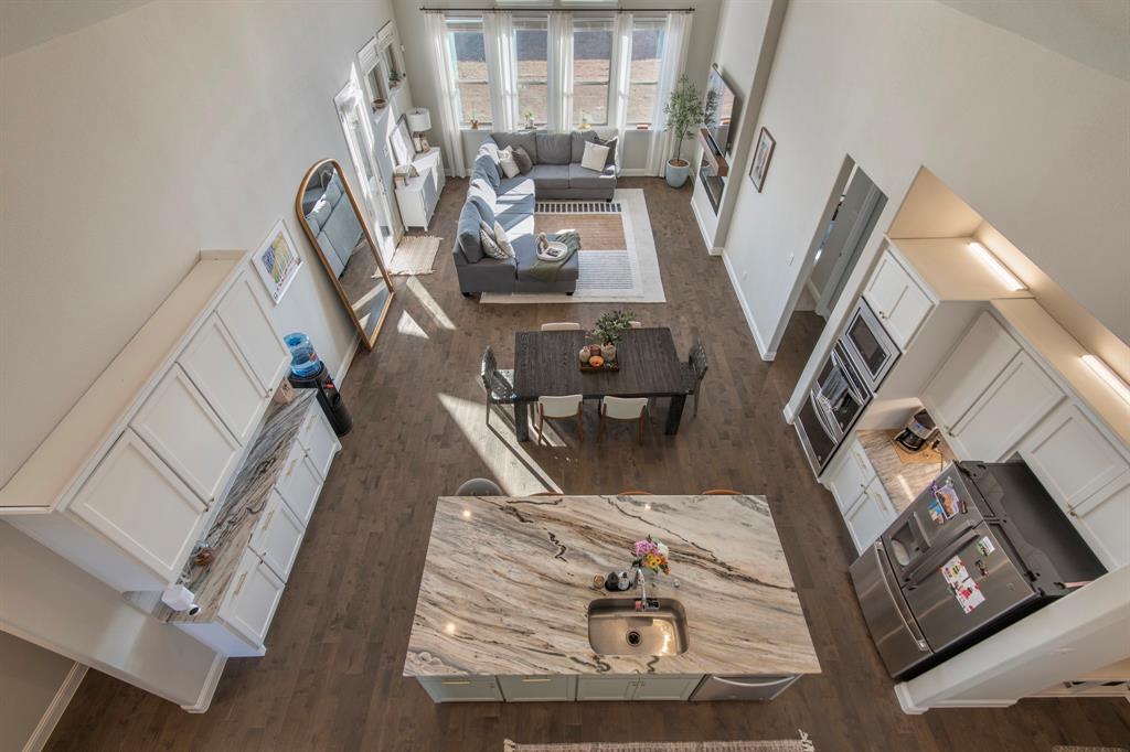 16650 Nightshade Road Frisco, TX 75033 - Photo 6 of 40 a view of living room with furniture and wooden floor