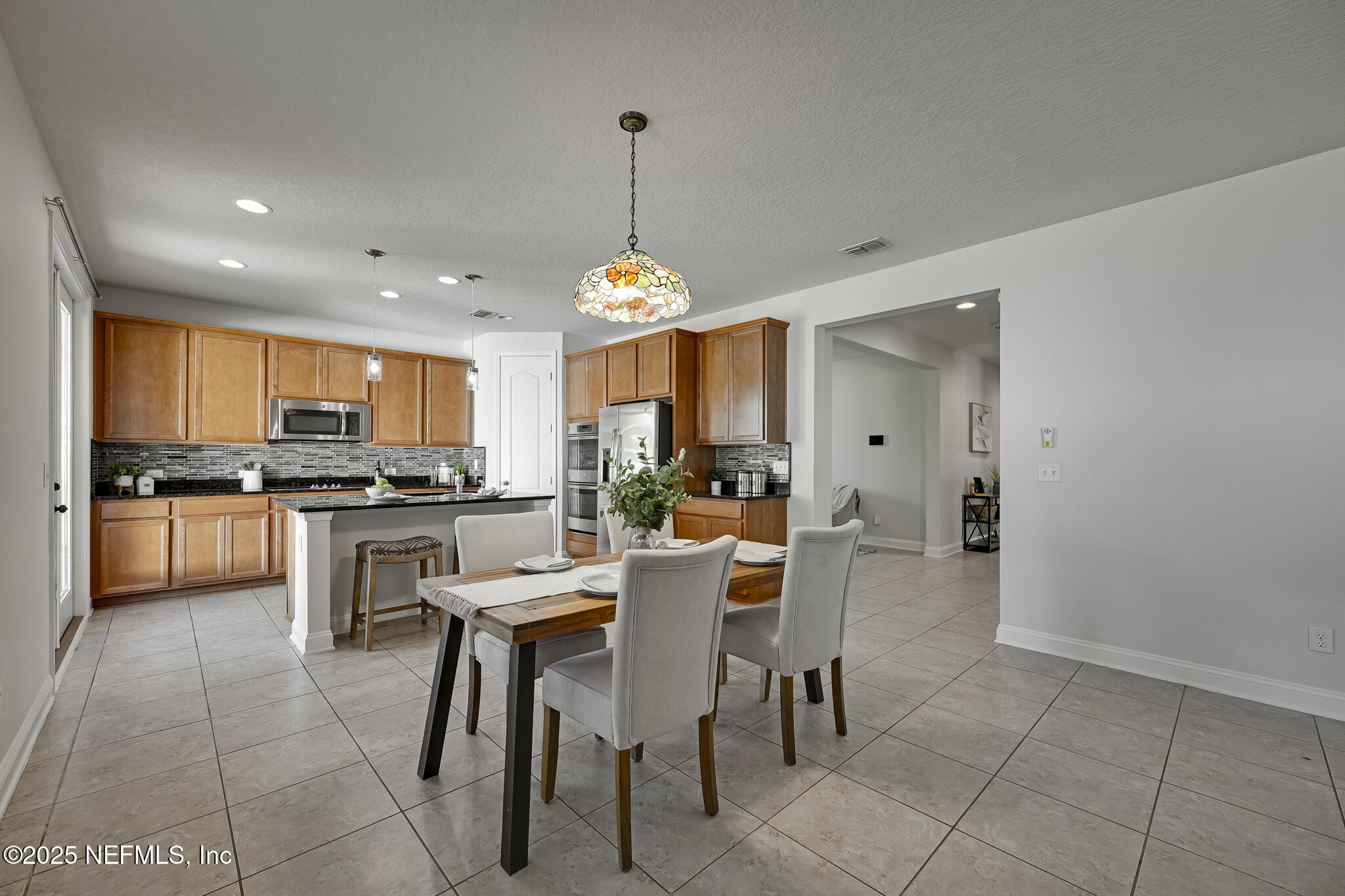 70 Quartz Place St. Augustine, FL 32086 - Photo 3 of 43 02 Dining Room and Kitchen