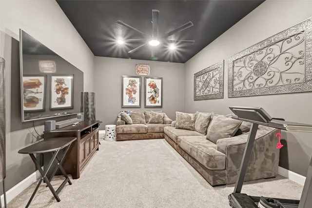 a living room with furniture and a air conditioner vent