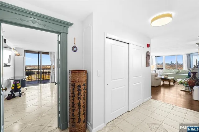 a view of a livingroom with furniture and natural light
