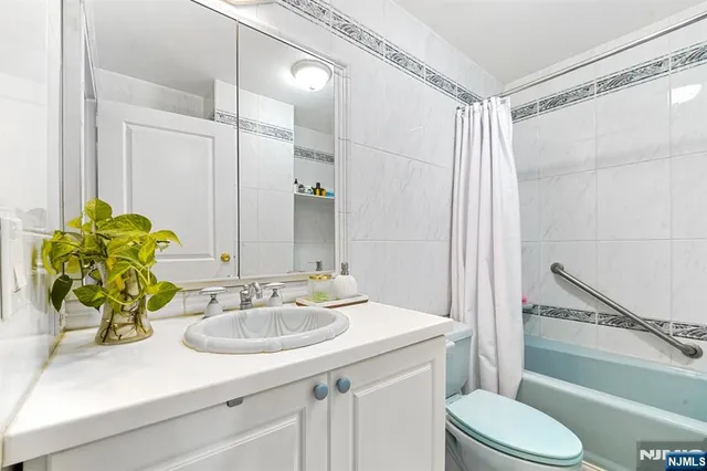 a bathroom with a sink double vanity and a mirror