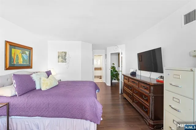 a bedroom with bed and a window