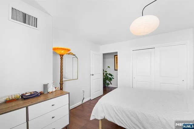 a bed room with furniture and a window