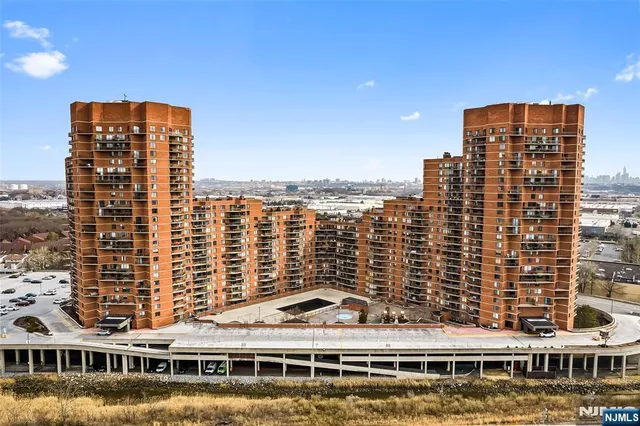 a reading room with furniture and a floor to ceiling window