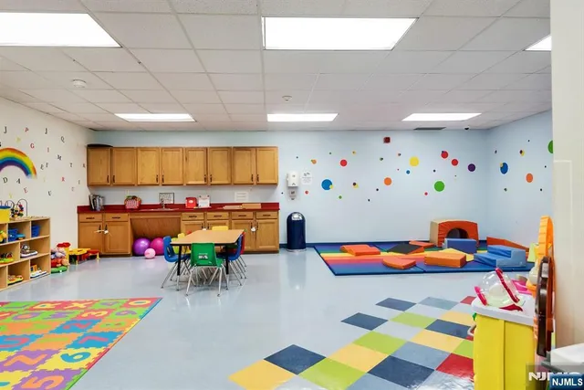 a view of a kitchen with a sink and a stove