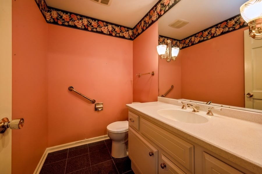 2961 Cherry Lane Northbrook, IL 60062 - Photo 9 of 21 a bathroom with a sink a toilet and shower curtain
