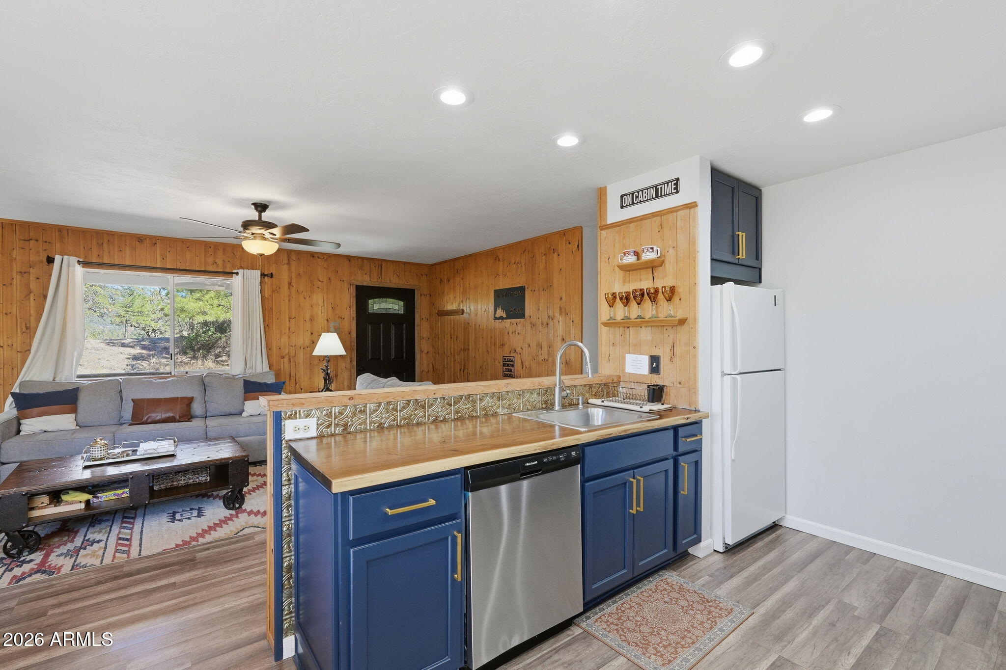 8247 Ralls Drive Pine, AZ 85544 - Photo 12 of 50 a kitchen with a counter space sink stove and refrigerator