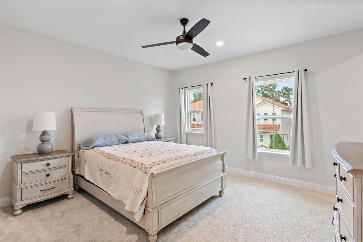 96014 Enclave Manor Fernandina Beach, FL 32034 - Photo 20 of 32 a bedroom with a bed and a window