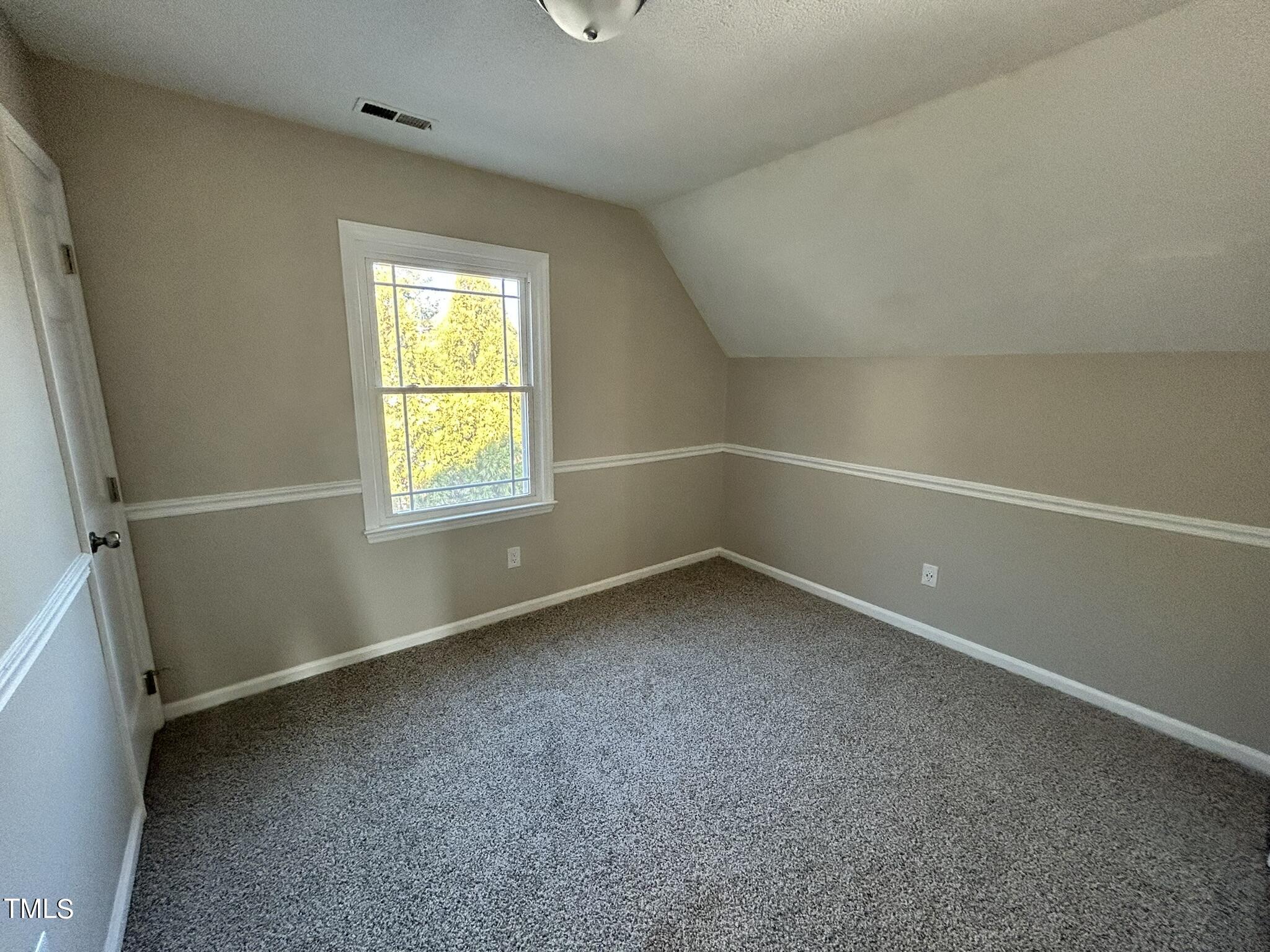 13535 Cleveland Road Garner, NC 27529 - Photo 12 of 18 an empty room with a window