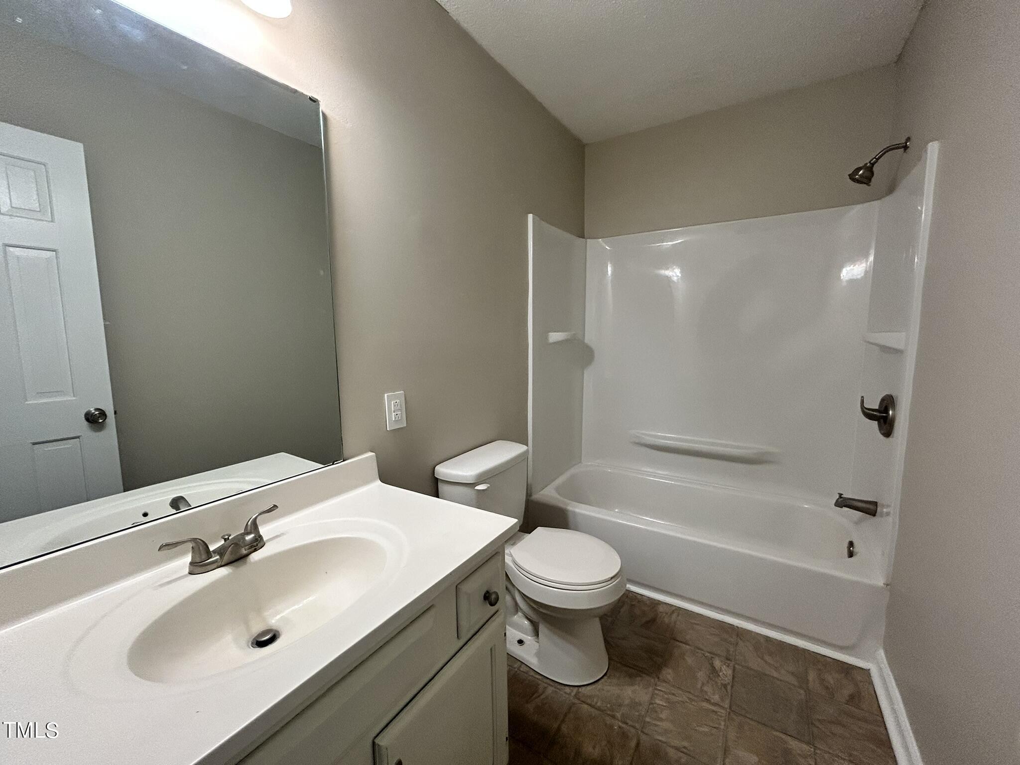13535 Cleveland Road Garner, NC 27529 - Photo 13 of 18 a bathroom with a sink toilet and shower