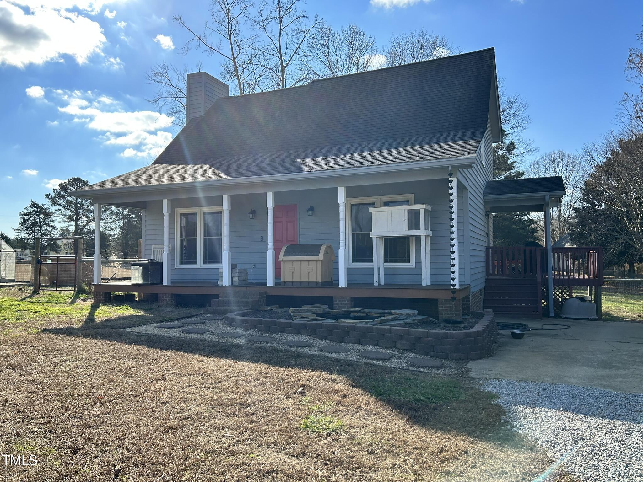 13535 Cleveland Road Garner, NC 27529 - Photo 2 of 18 a front view of a house with garden