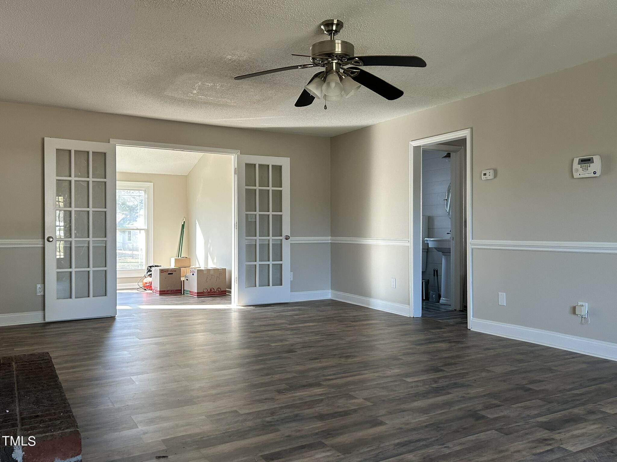 13535 Cleveland Road Garner, NC 27529 - Photo 6 of 18 an empty room with wooden floor and windows
