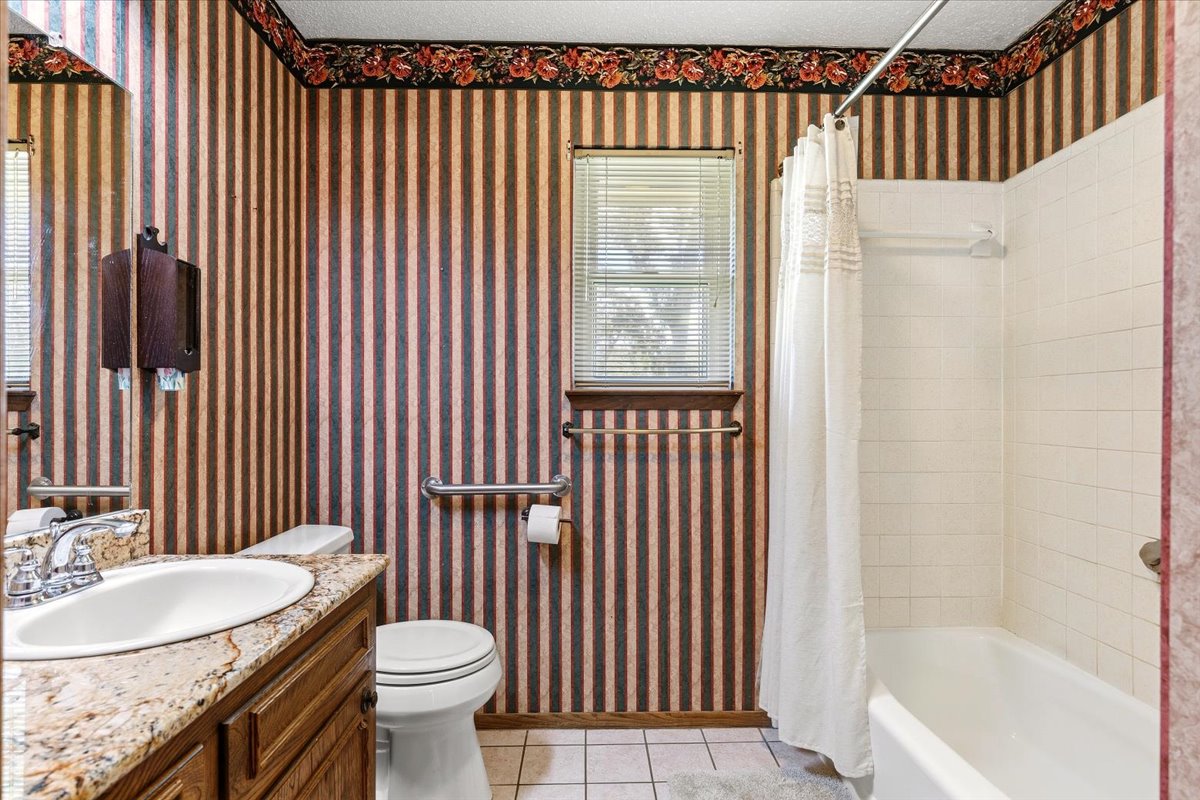 250 Hickory Drive Elgin, TX 78621 - Photo 21 of 37 a bathroom with a sink toilet and shower