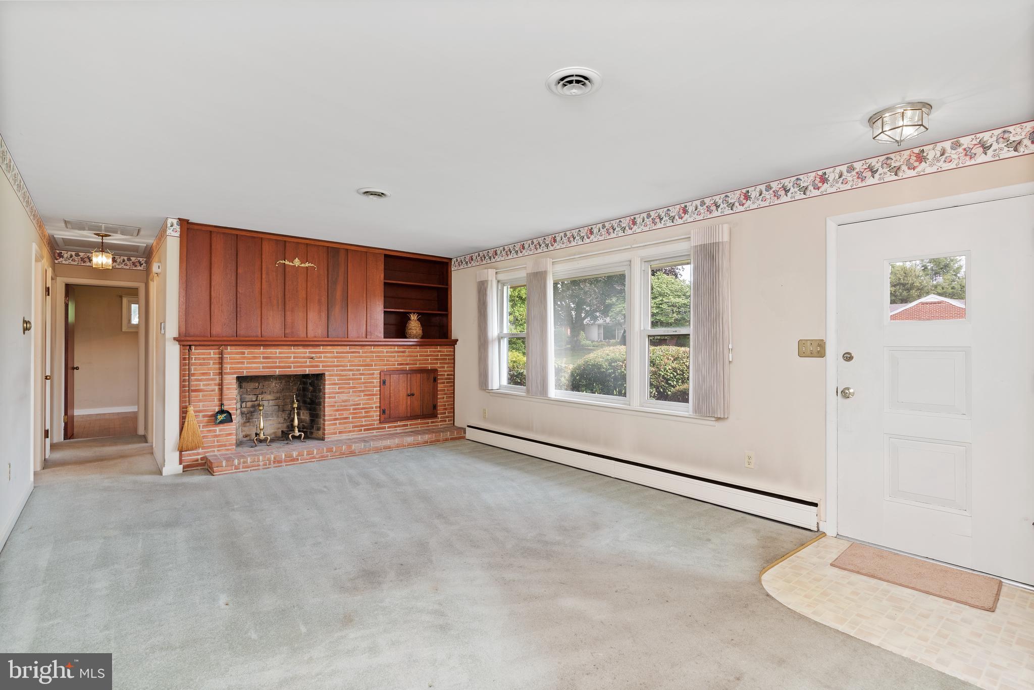Cozy Living Room w/ fireplace & built-ins
