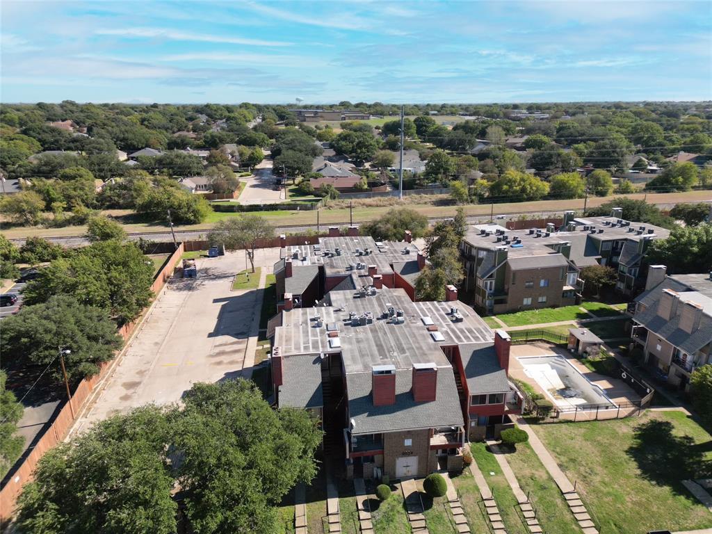 9839 Walnut Street, Unit 306 Dallas, TX 75243 - Photo 31 of 33 an aerial view of a house with a lake view