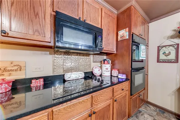 a kitchen filled with a refrigerator a stove a sink dishwasher and cabinets with wooden floor