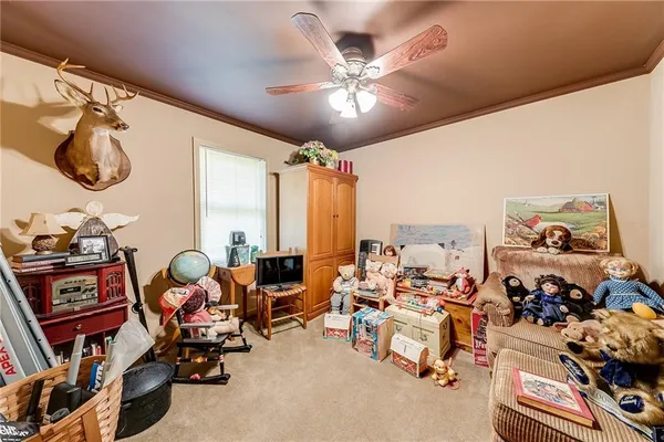 a bedroom with furniture and a window