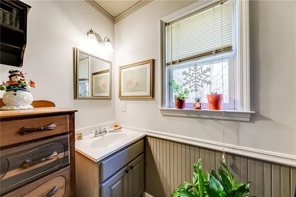 a living room with lots of furniture and a chandelier