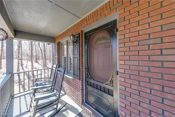 a view of a balcony with wooden floor