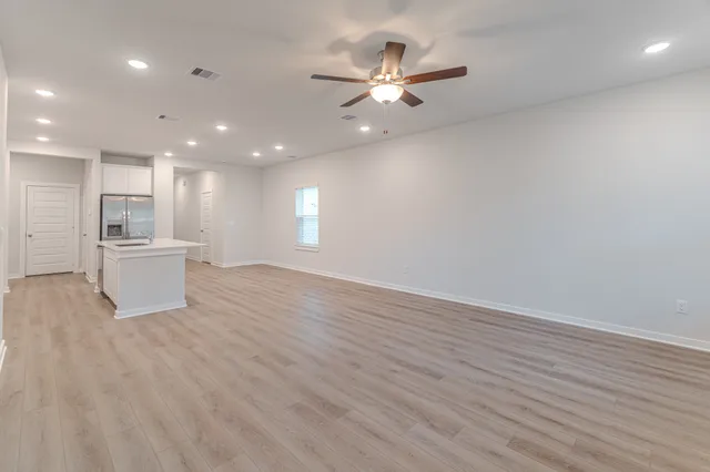 a view of a kitchen with a sink and a microwave