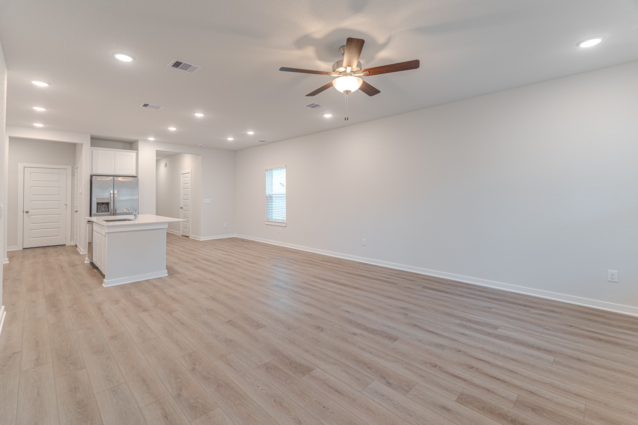 8570 Blueberry Ash Street Magnolia, TX 77354 - Photo 12 of 30 a view of a kitchen with a sink and a microwave