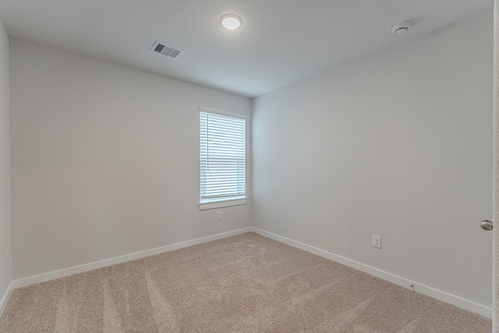 8570 Blueberry Ash Street Magnolia, TX 77354 - Photo 25 of 30 an empty room with a window