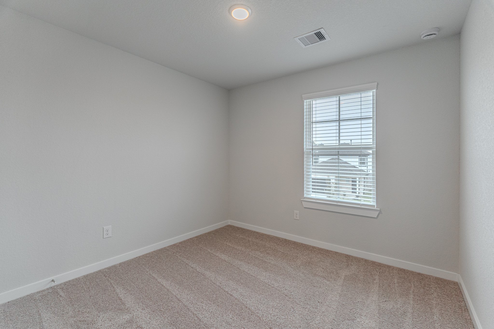 8570 Blueberry Ash Street Magnolia, TX 77354 - Photo 26 of 30 an empty room with a window