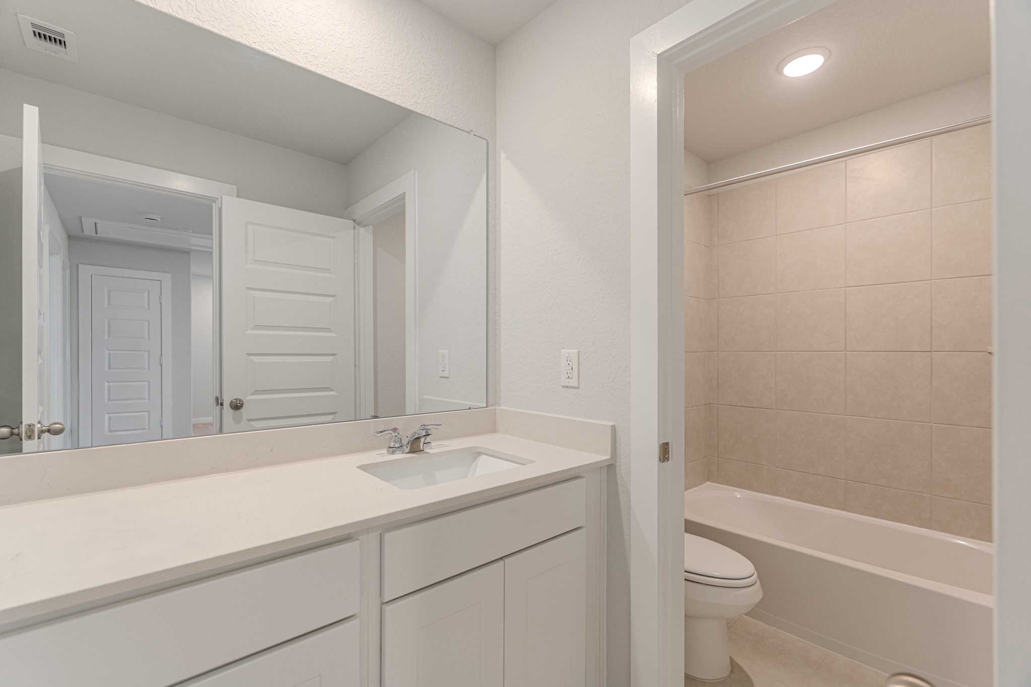 8570 Blueberry Ash Street Magnolia, TX 77354 - Photo 27 of 30 a bathroom with a sink a toilet and shower