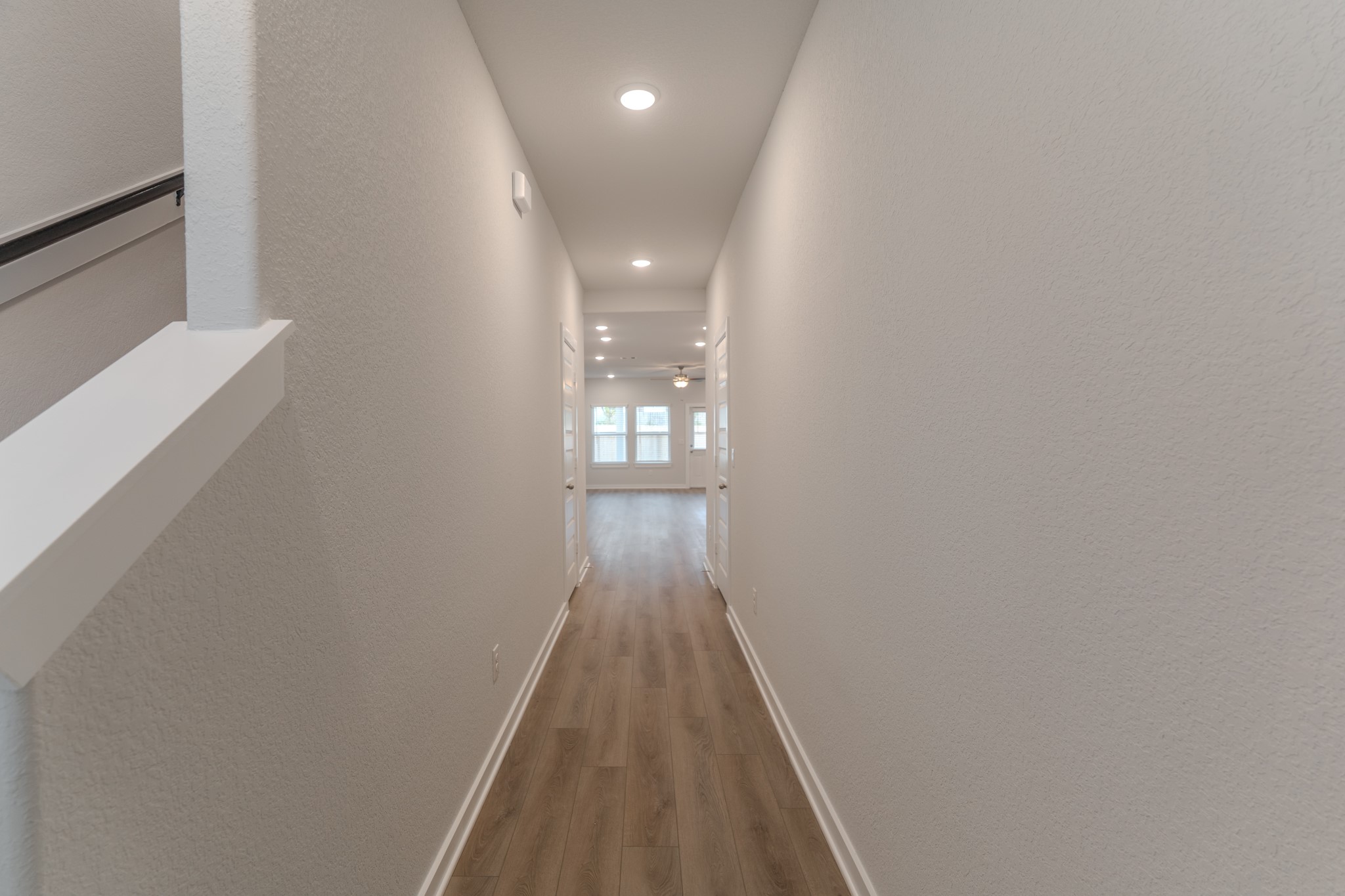 8570 Blueberry Ash Street Magnolia, TX 77354 - Photo 3 of 30 a view of a hallway with wooden floor