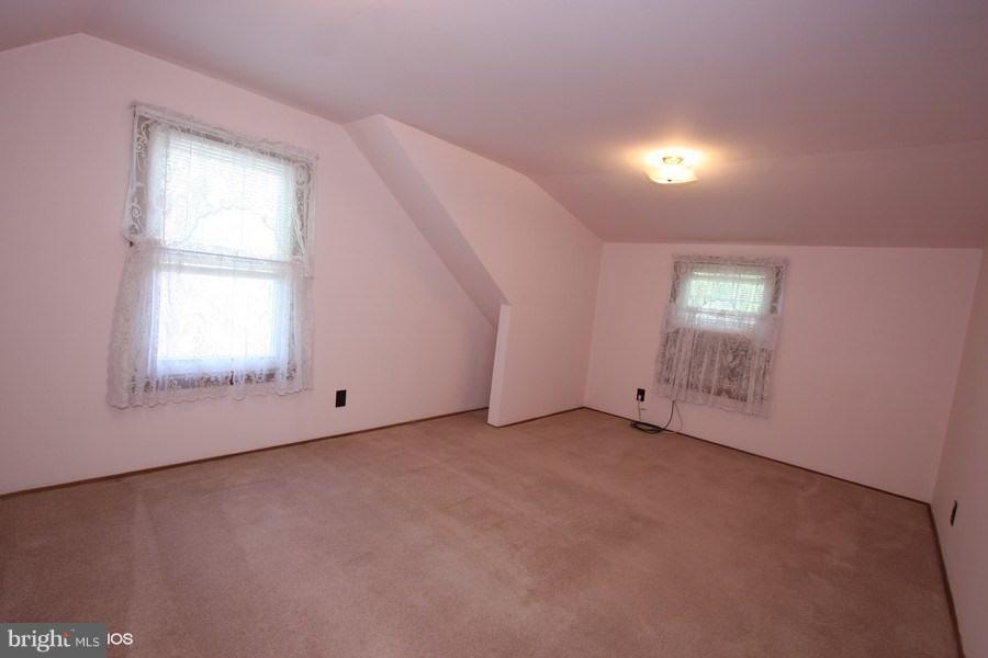412 West Maple Road Linthicum Heights, MD 21090 - Photo 12 of 28 an empty room with windows