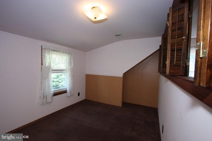 412 West Maple Road Linthicum Heights, MD 21090 - Photo 13 of 28 a view of an empty room with windows